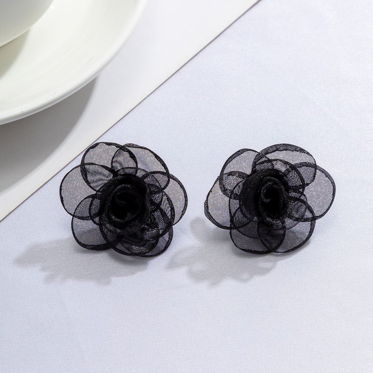 Mesh rose studs